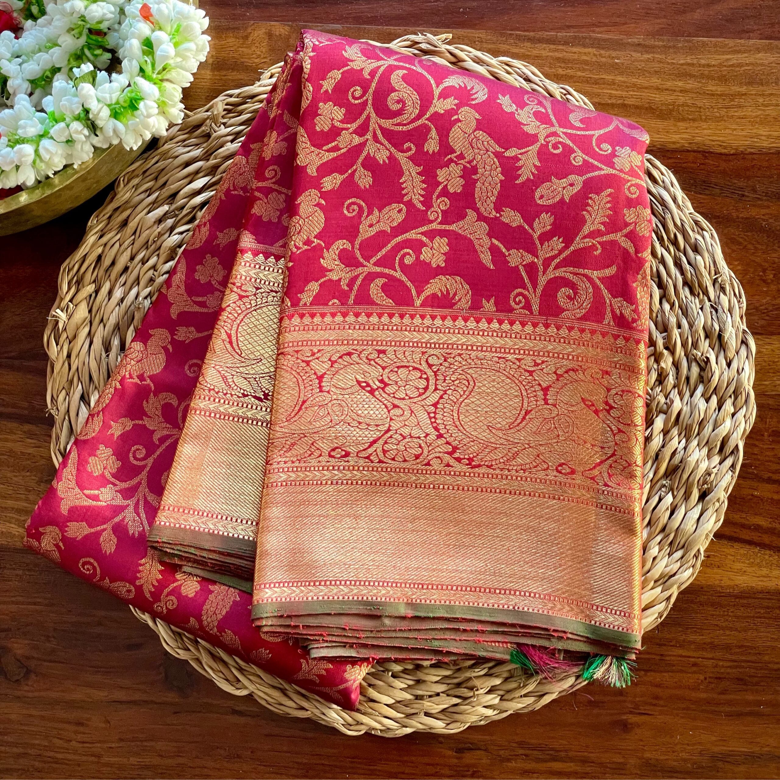 Shaili maroon Kanjivaram silk saree with pure zari parrot motifs and Annam border.