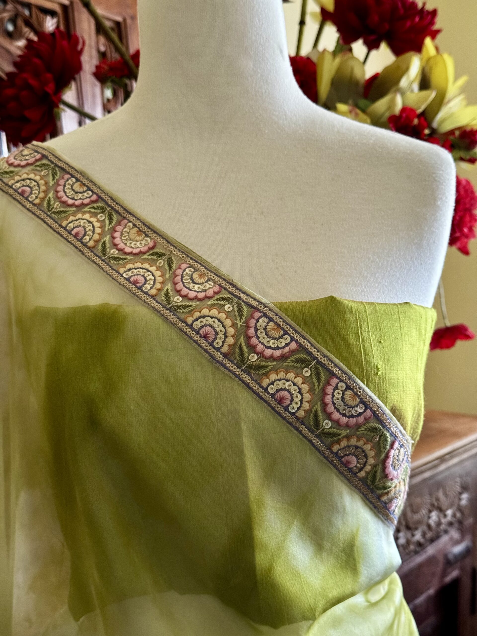 Anvika olive green tie & dye organza saree with lace border and green raw silk blouse fabric