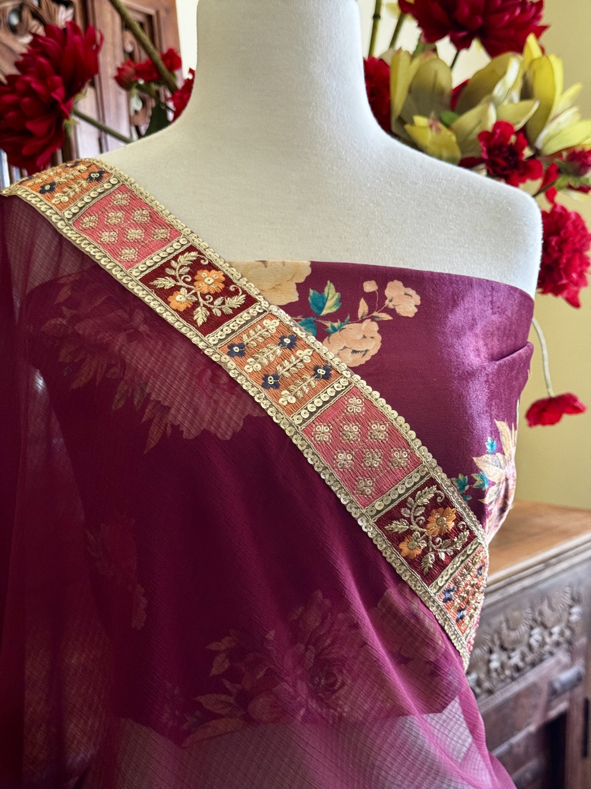 Mihira maroon georgette saree with lace borders and floral velvet blouse fabric
