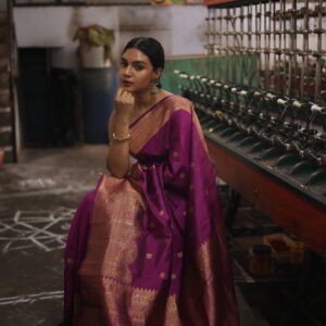 Sankalpa deep magenta silk saree with gold zari turning border and rich pallu.