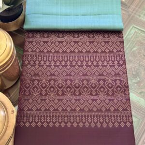 Jivika sea green silk saree with deep brown wine zari pallu and geometric motifs.