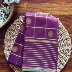 Maroon silk saree with 2g pure zari checks and Irruthalai Pakshi motifs.