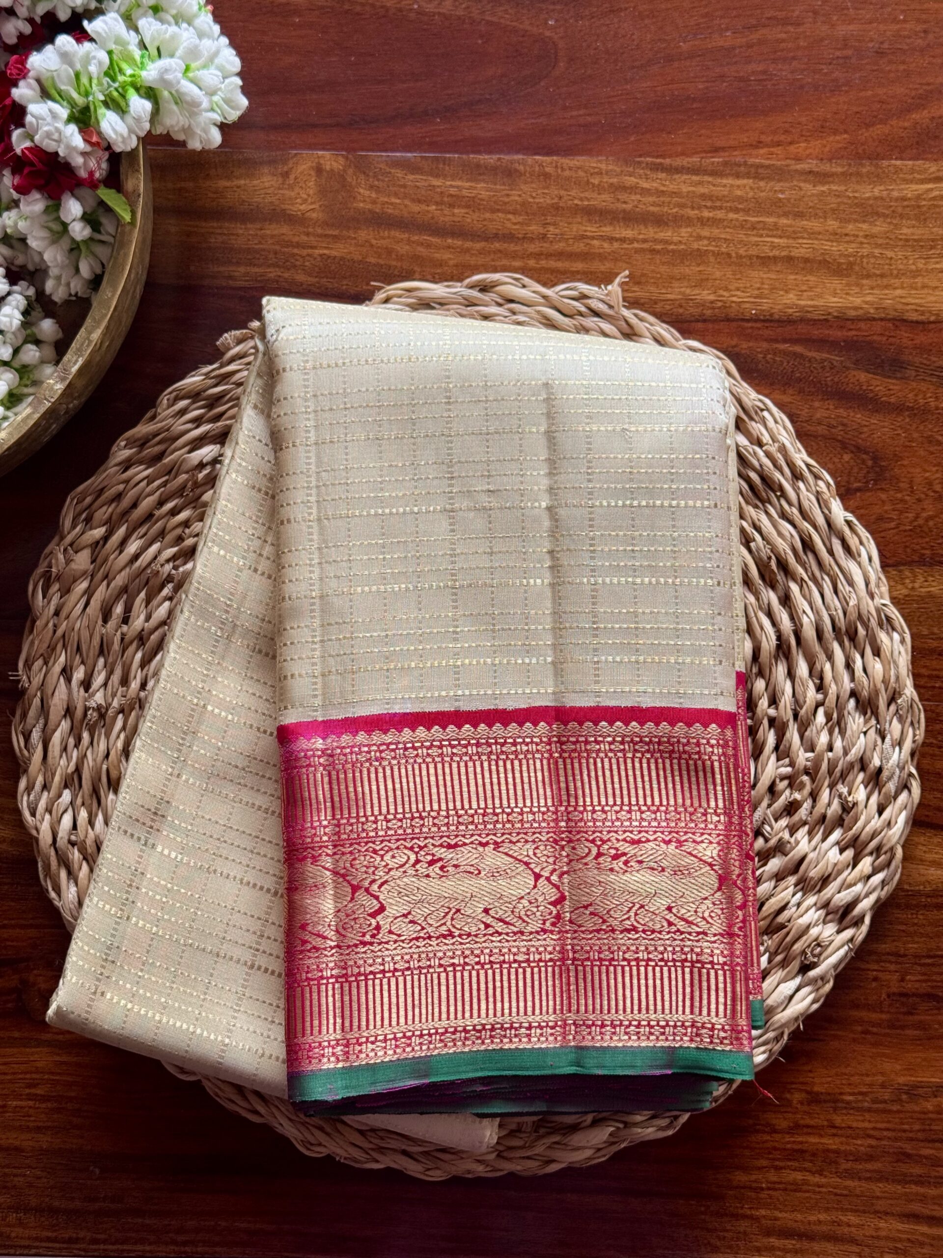 Sidhika silk saree featuring 2g gold zari and a hand-woven pallu with green selvedge.