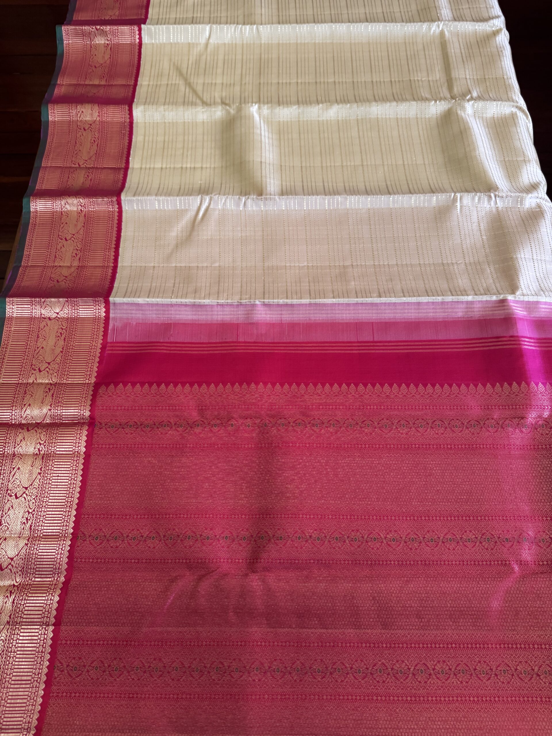 Sidhika silk saree featuring 2g gold zari and a hand-woven pallu with green selvedge.