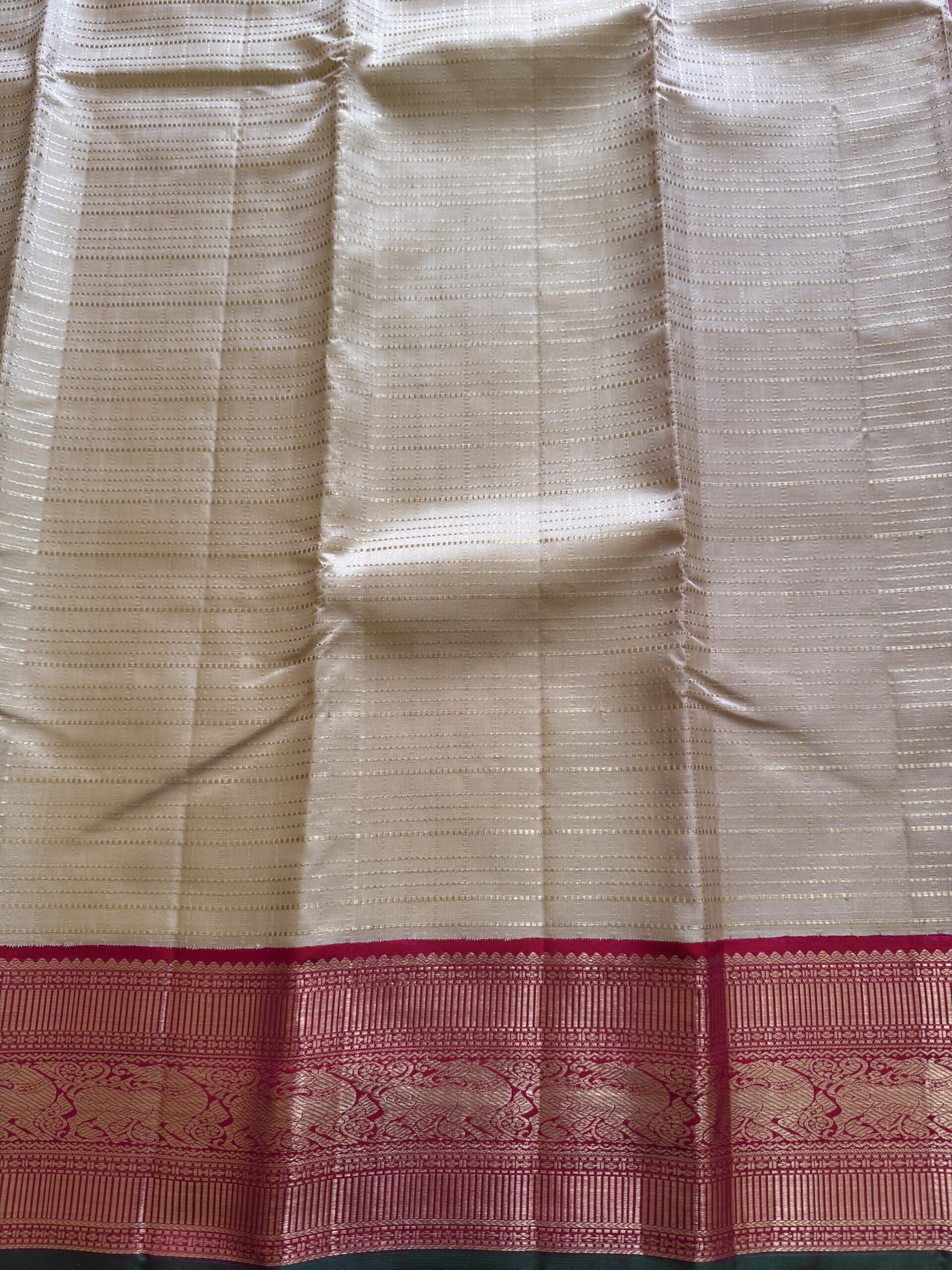 Sidhika silk saree featuring 2g gold zari and a hand-woven pallu with green selvedge.