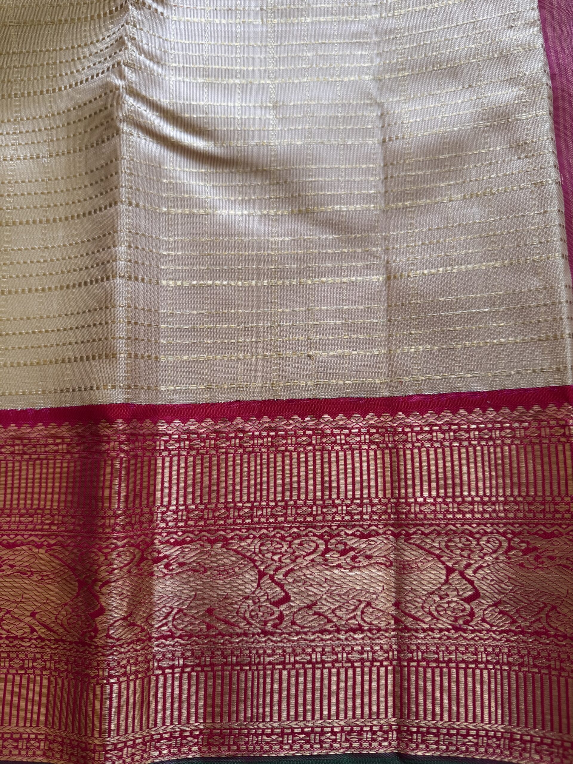 Sidhika silk saree featuring 2g gold zari and a hand-woven pallu with green selvedge.