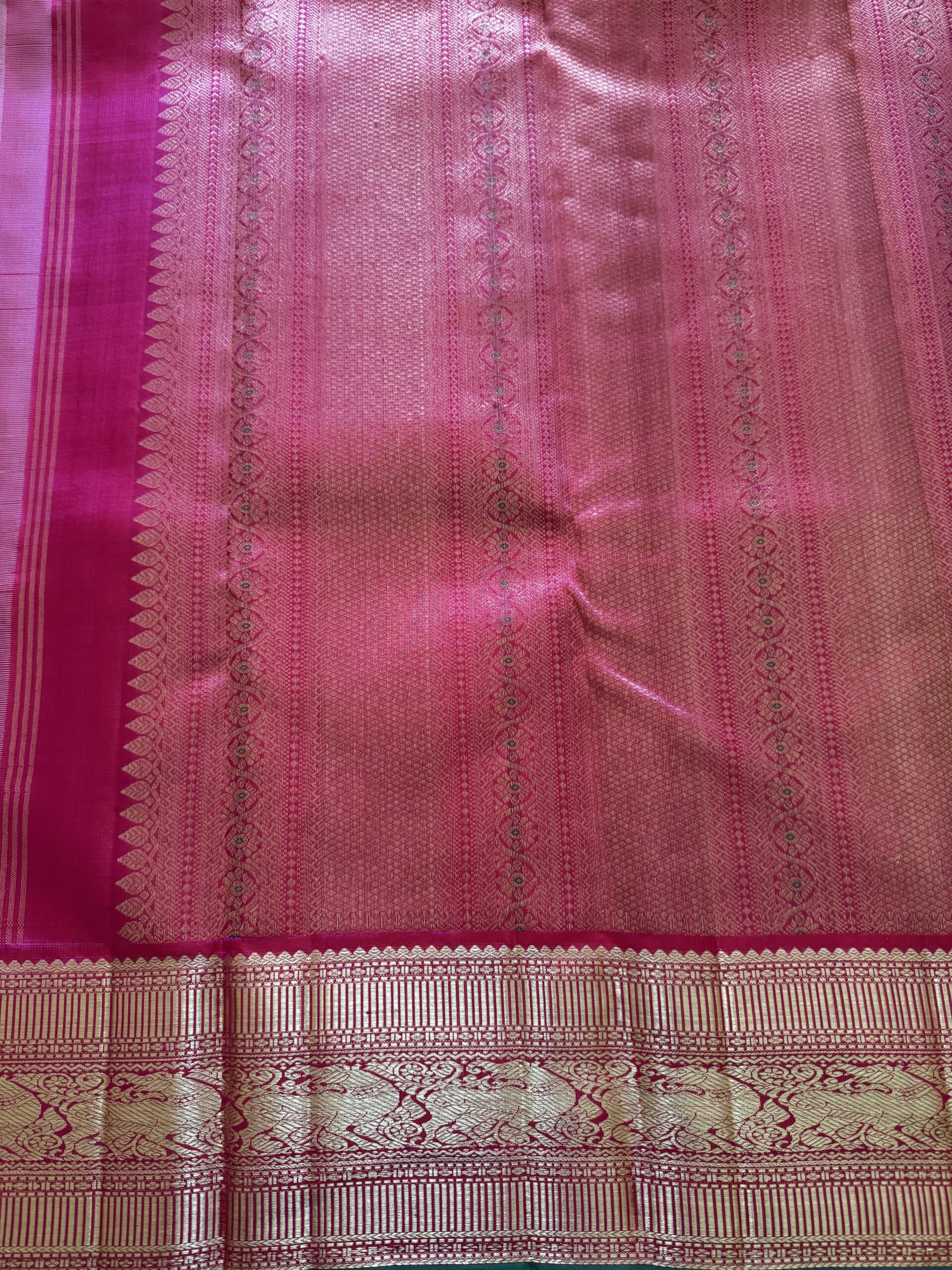 Sidhika silk saree featuring 2g gold zari and a hand-woven pallu with green selvedge.