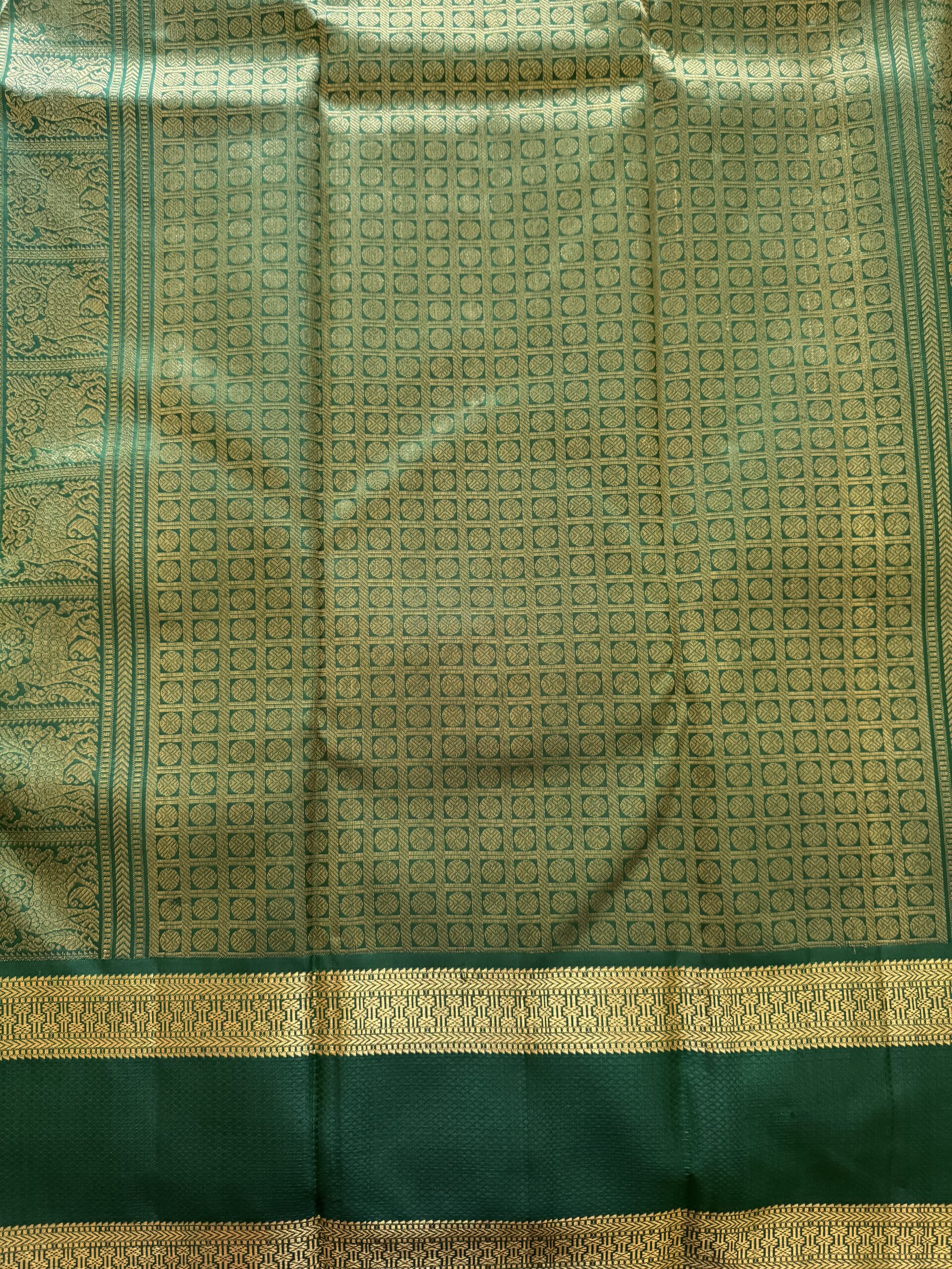 Heavy emerald green silk pallu with dense 3g gold zari traditional weaving
