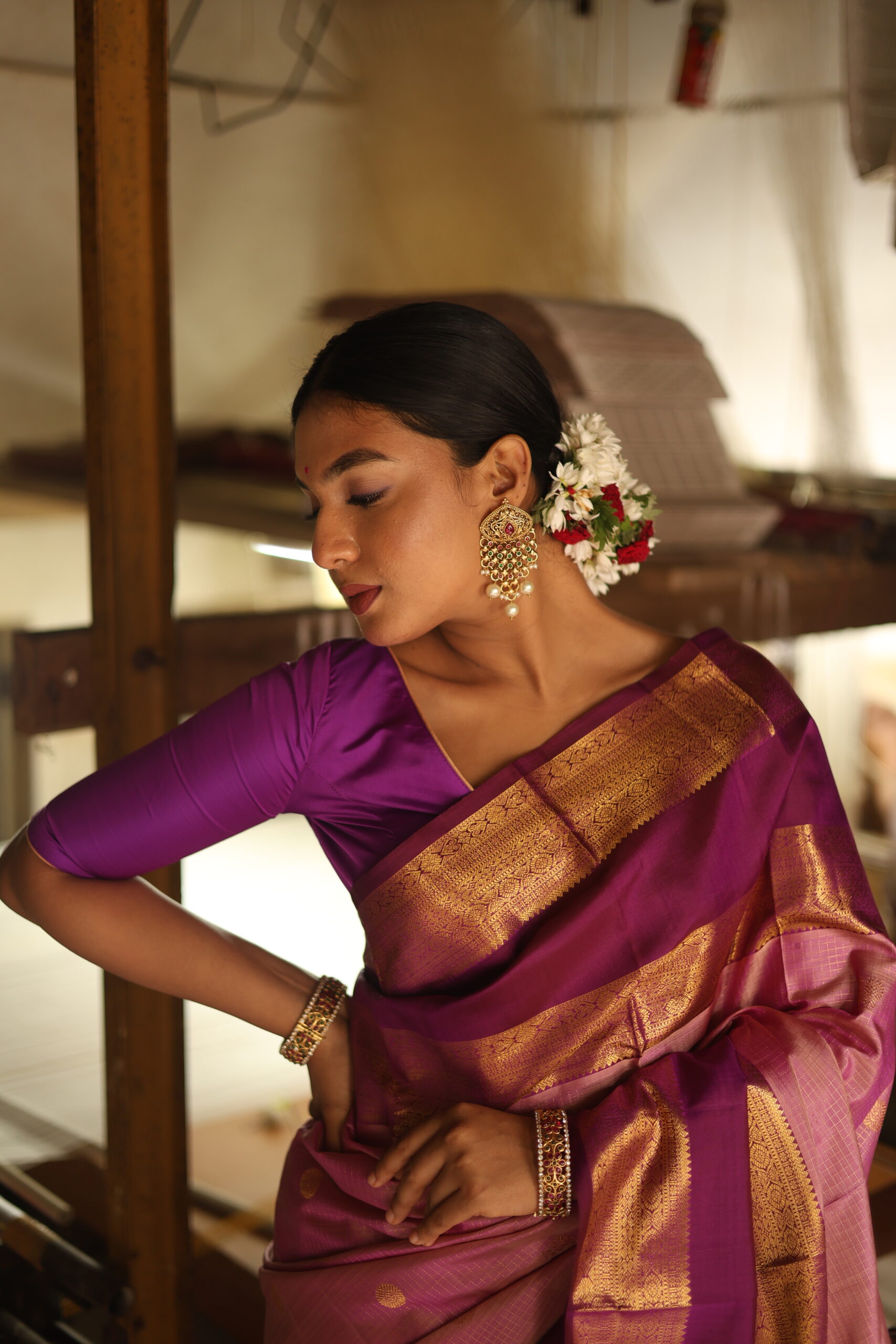 Oviya onion pink Kanjivaram silk saree with woven micro-checks and a deep magenta border.
