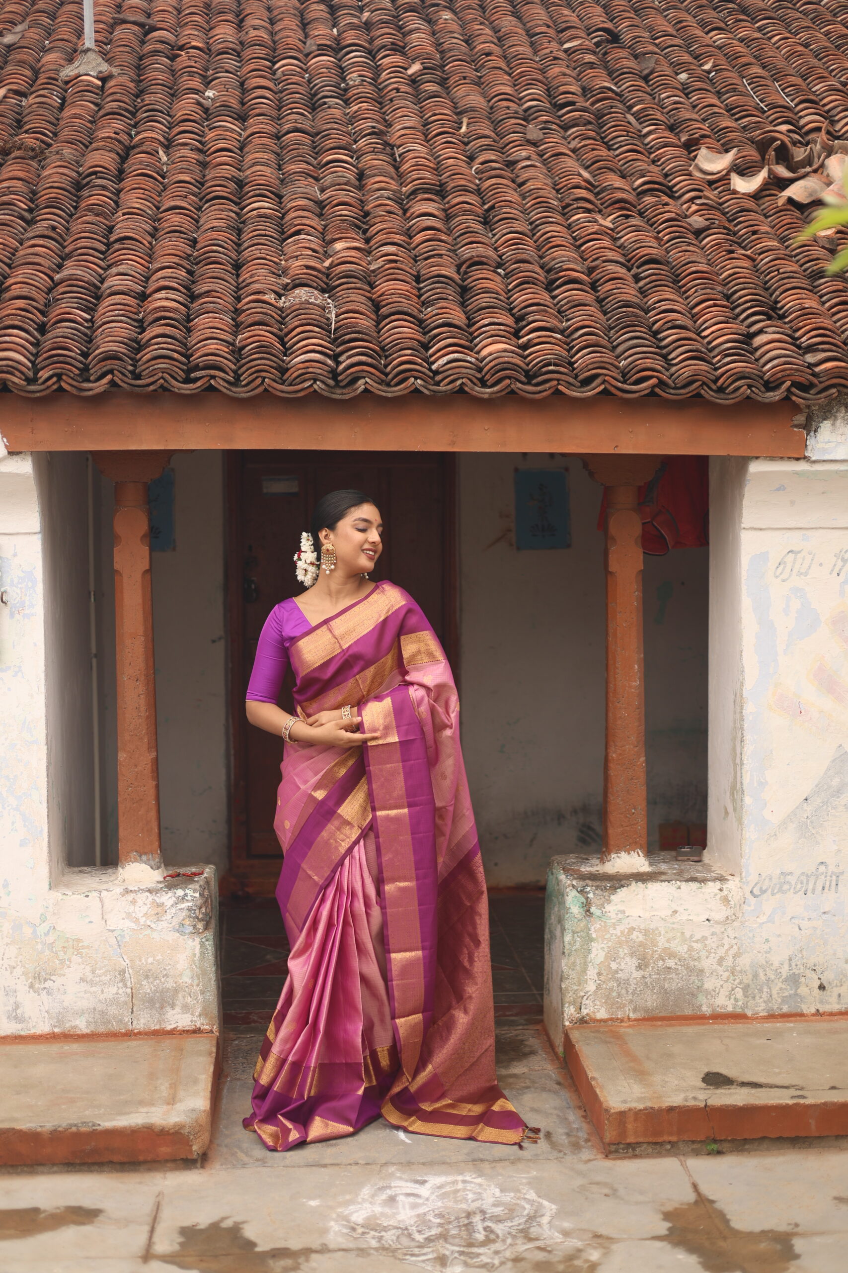 Oviya onion pink Kanjivaram silk saree with woven micro-checks and a deep magenta border.