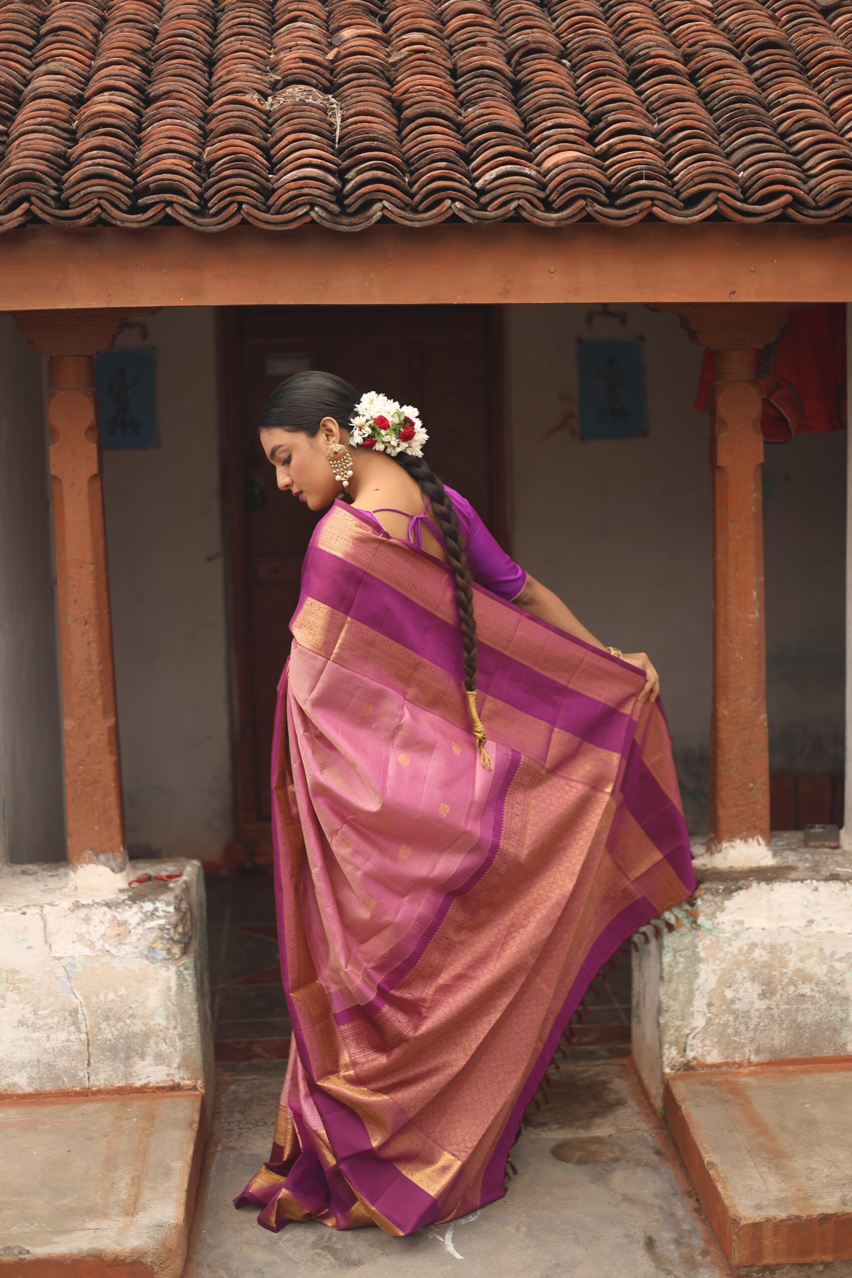 Oviya onion pink Kanjivaram silk saree with woven micro-checks and a deep magenta border.