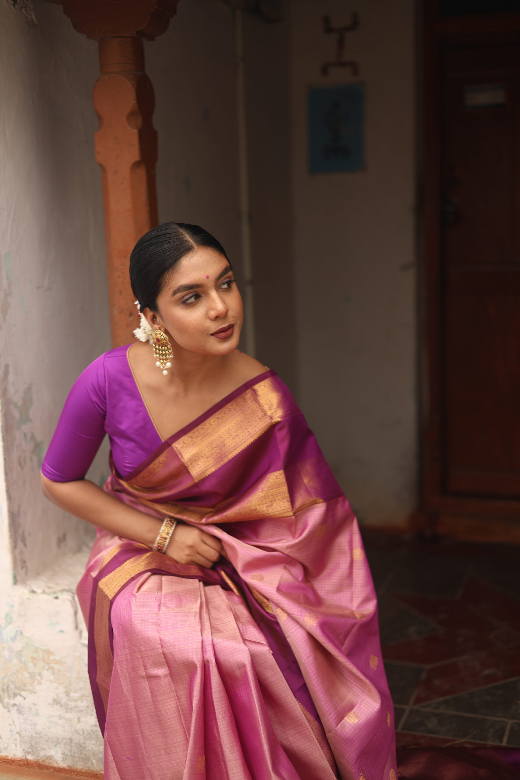 Oviya onion pink Kanjivaram silk saree with woven micro-checks and a deep magenta border.