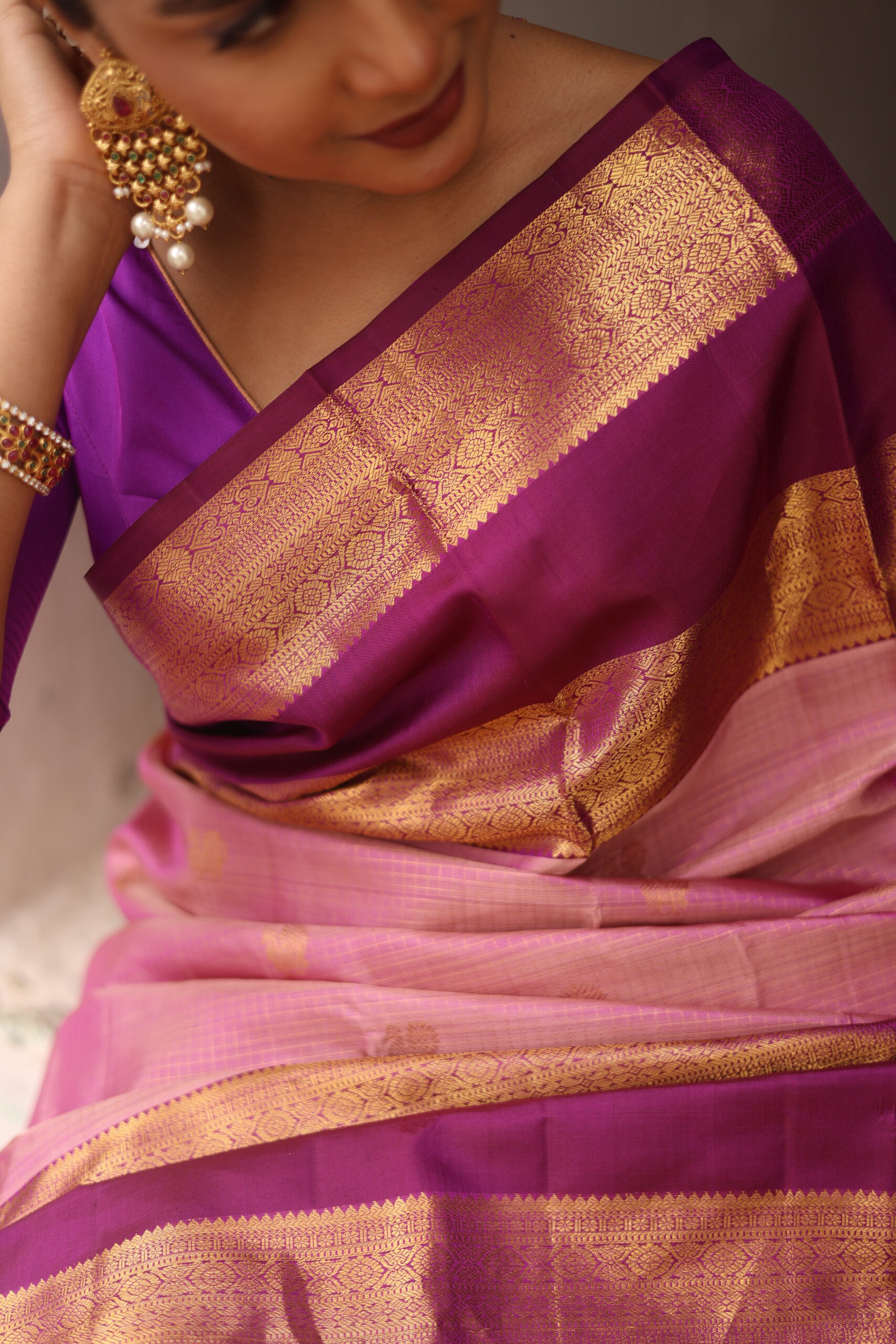Oviya onion pink Kanjivaram silk saree with woven micro-checks and a deep magenta border.