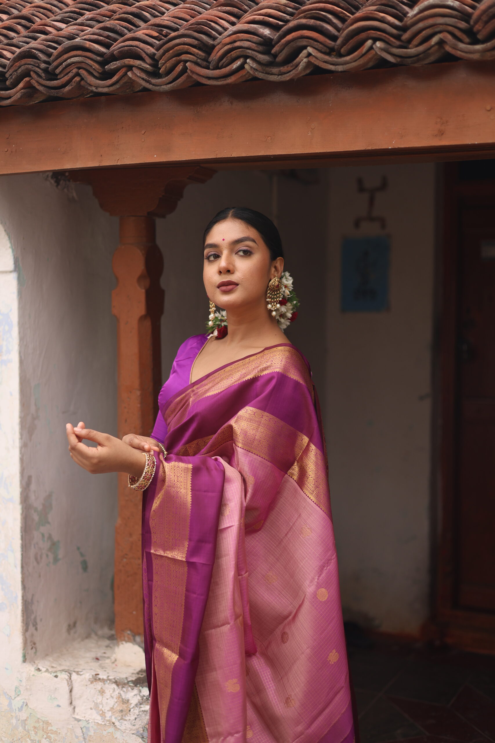 Oviya onion pink Kanjivaram silk saree with woven micro-checks and a deep magenta border.