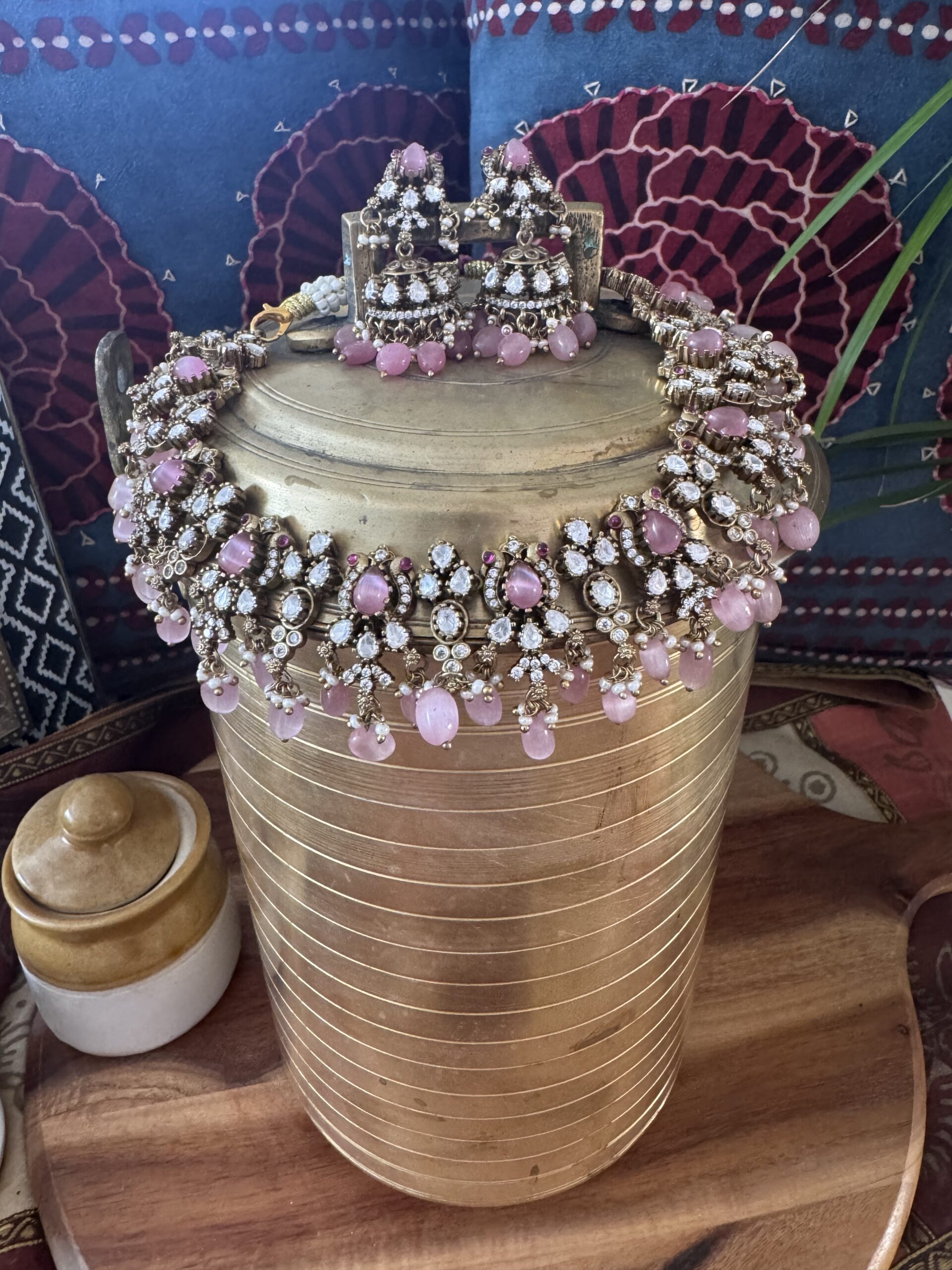 Gold-toned Victorian necklace with pink and white stones and matching earrings.