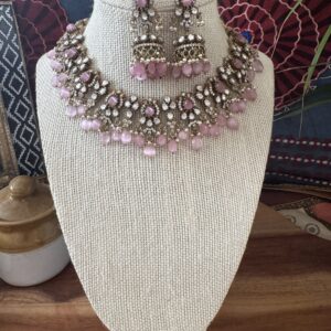 Gold-toned Victorian necklace with pink and white stones and matching earrings.
