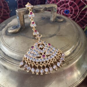 Gold-toned Nethi Chutti with clear and ruby stones