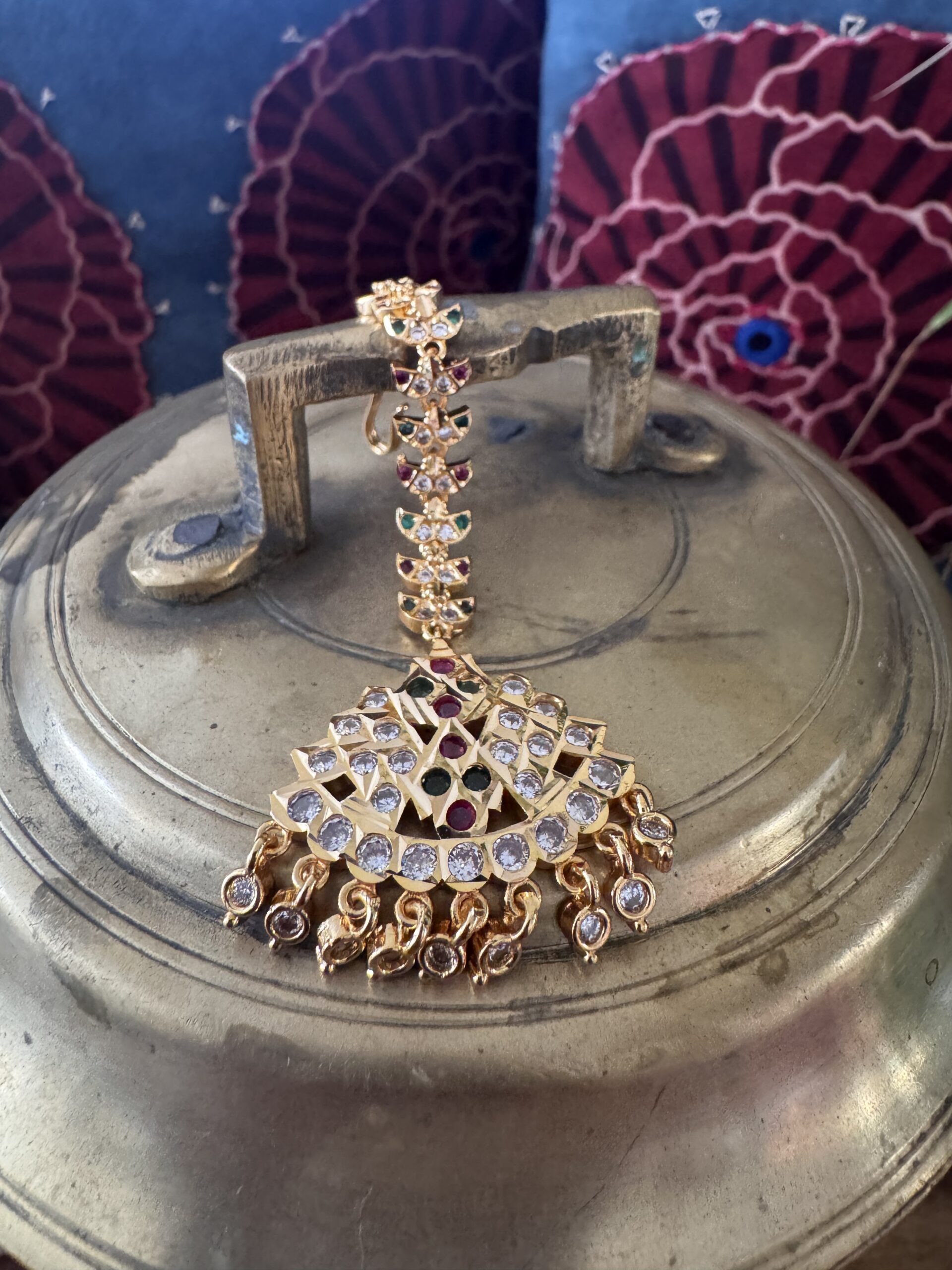 Gold-toned Nethi Chutti with red, green, and white stones