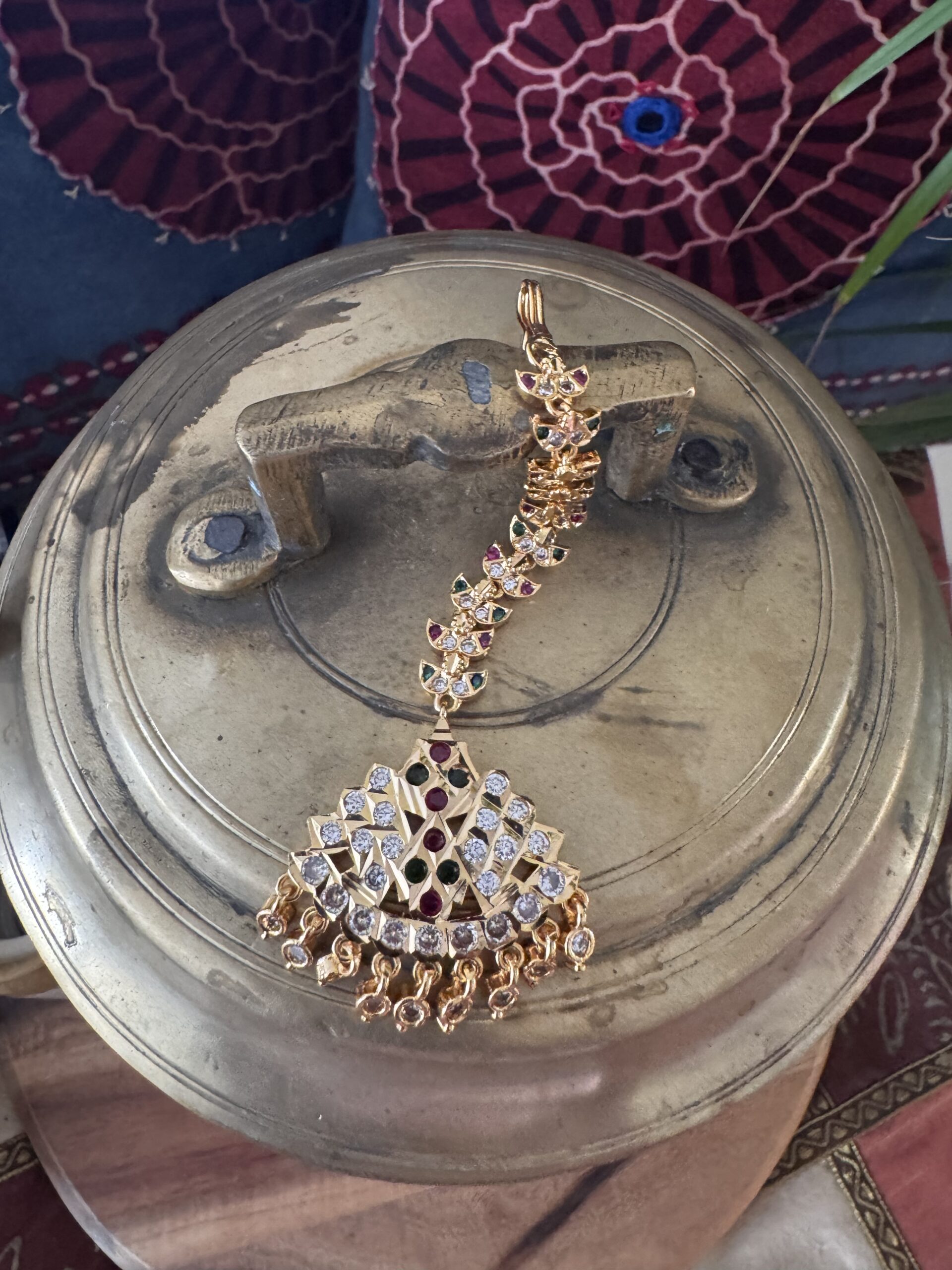 Gold-toned Nethi Chutti with red, green, and white stones