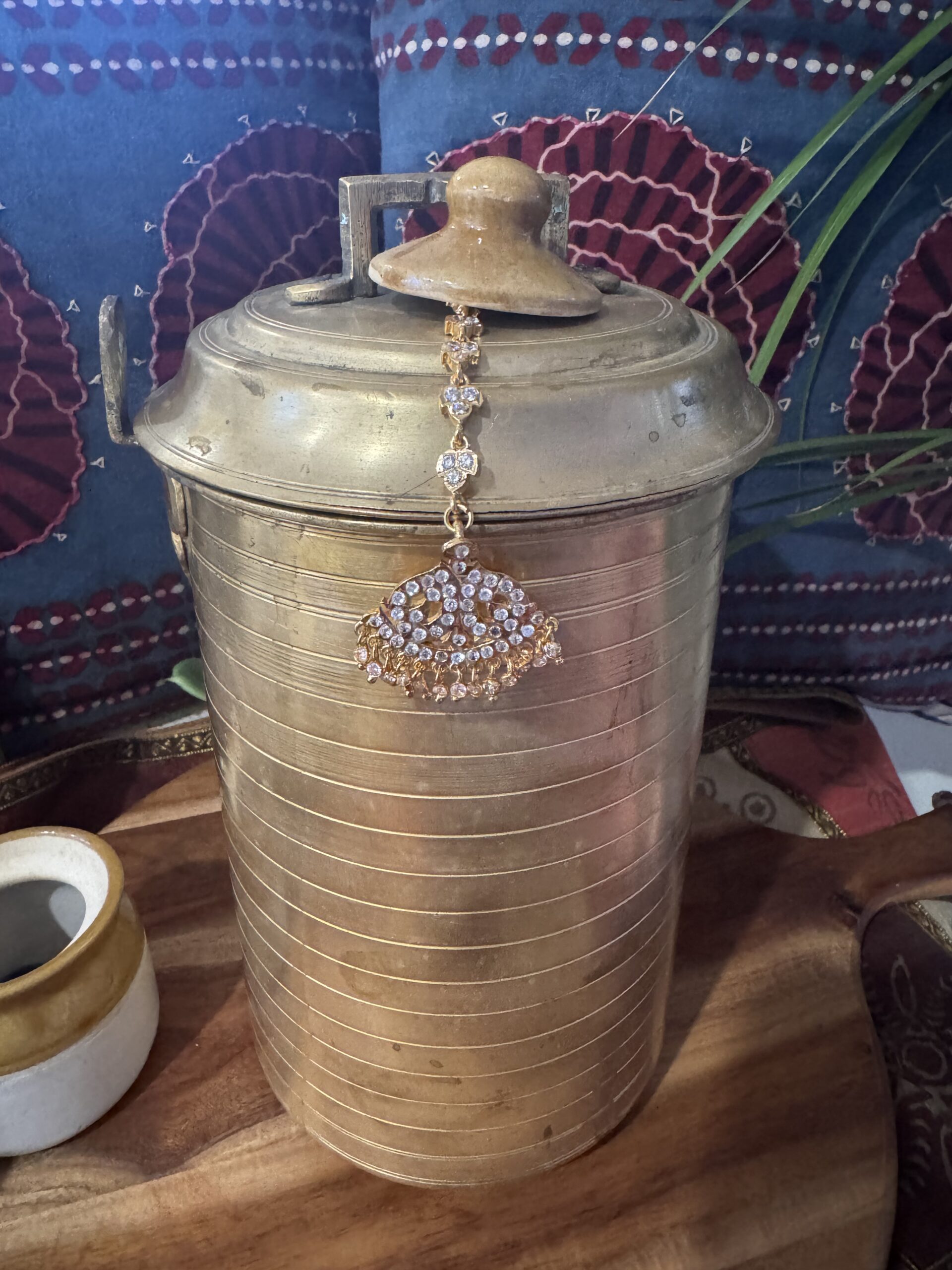 Gold-toned Nethi Chutti with red, green, and white stones