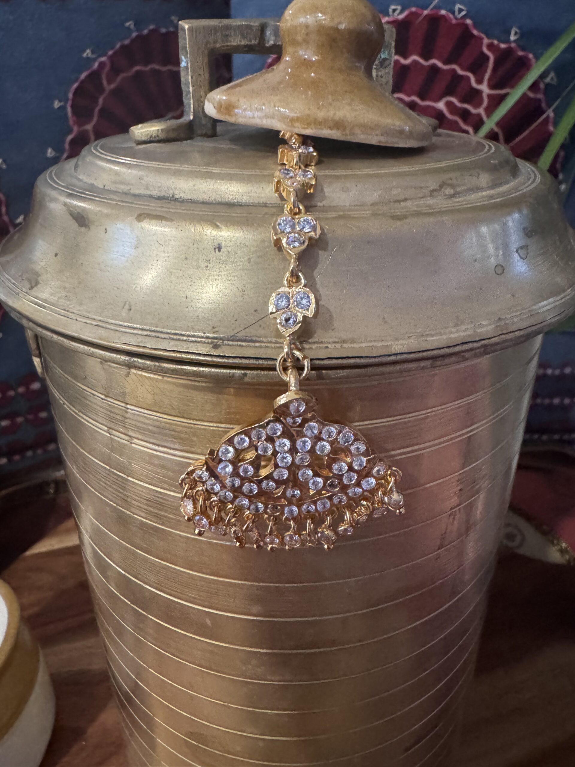Gold-toned Nethi Chutti with red, green, and white stones