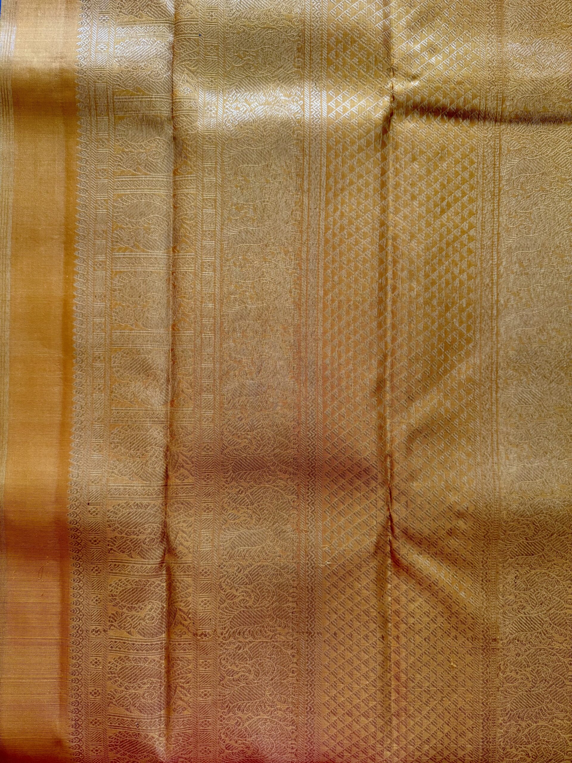 Hamsini teal blue pure Kanjivaram silk saree with all-over zari motifs and a golden yellow 3g zari pallu.