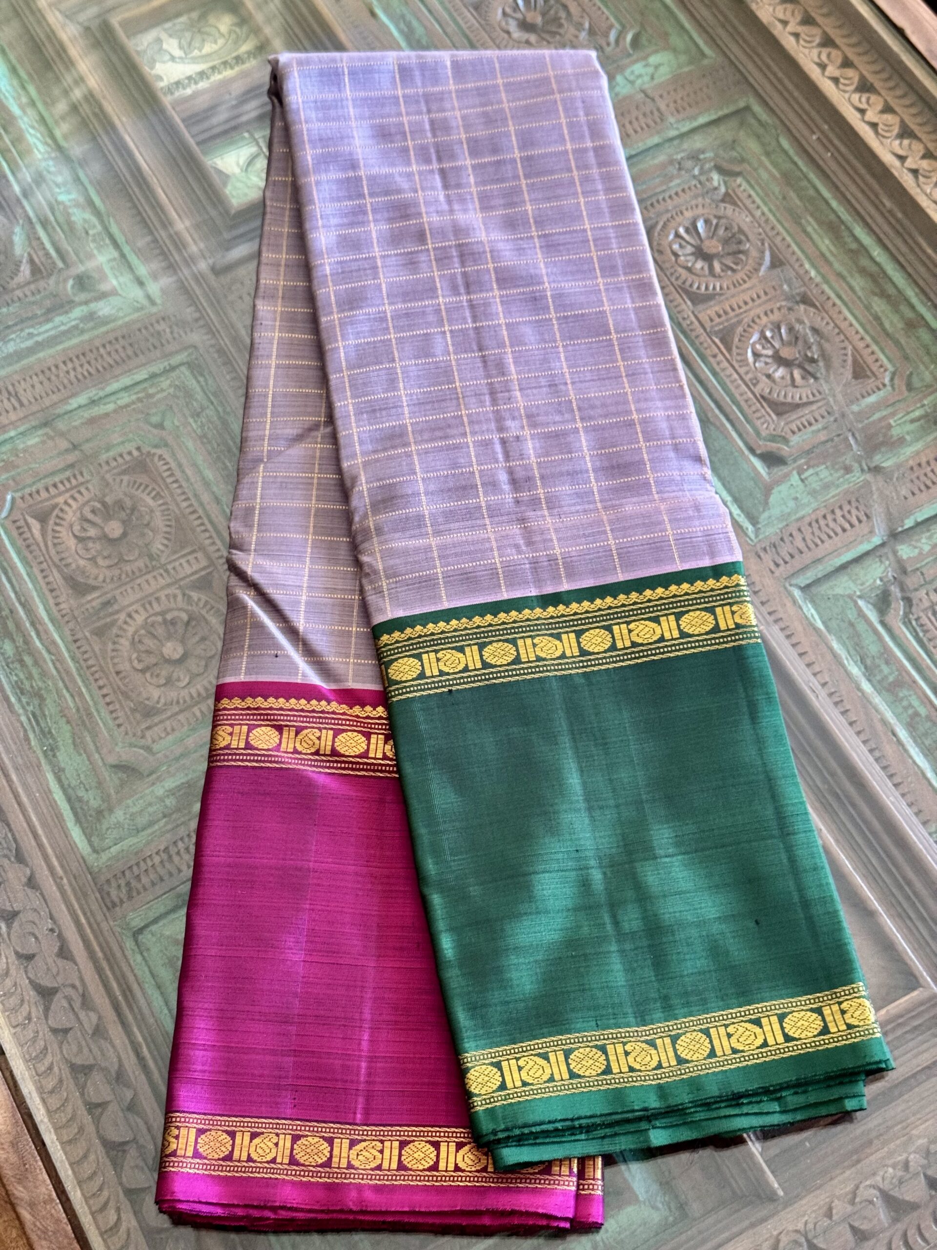 Aavani grey shot Ganga Yamuna Kanjivaram silk saree with contrast magenta and green borders.