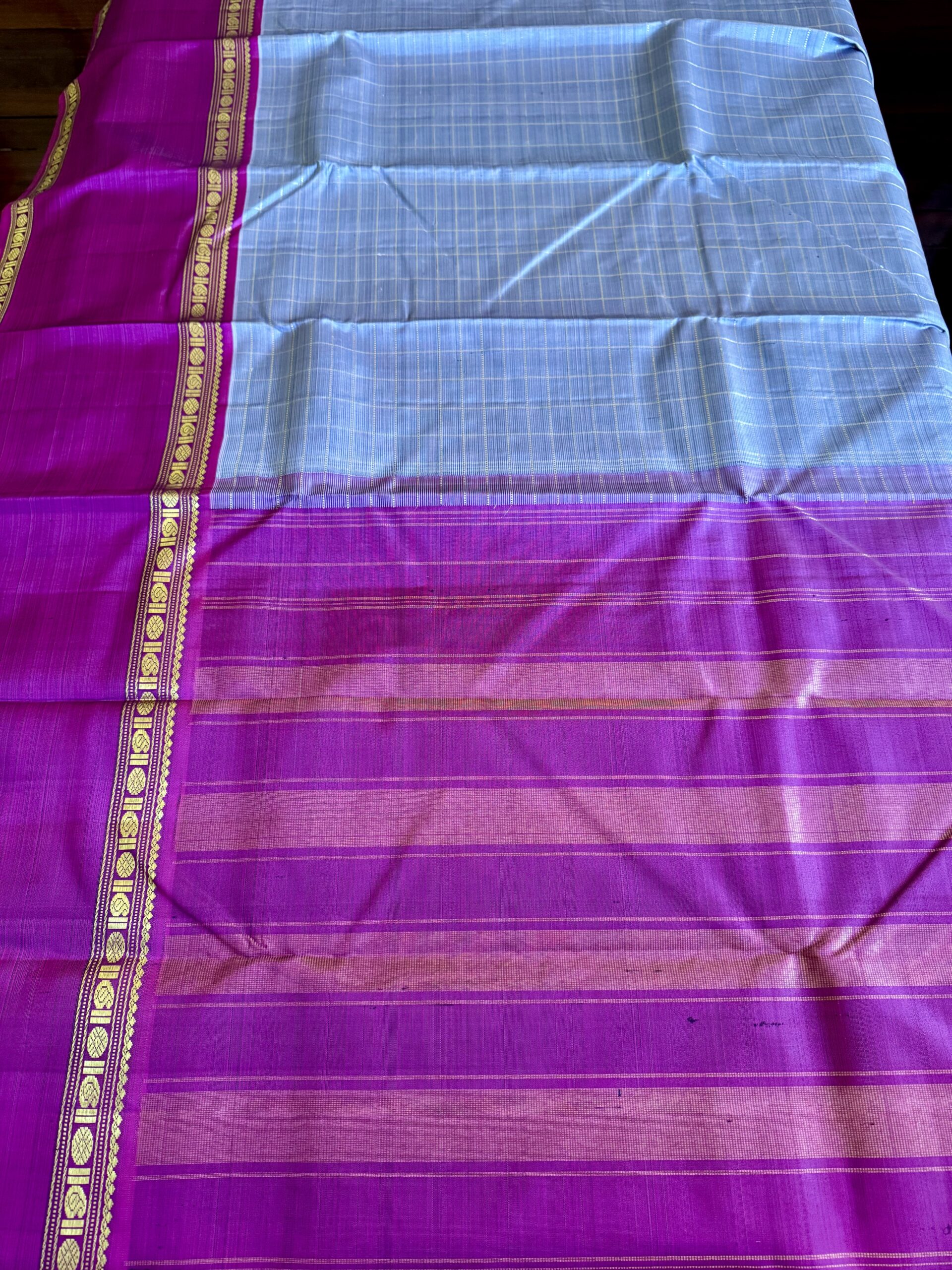 Aavani grey shot Ganga Yamuna Kanjivaram silk saree with contrast magenta and green borders.