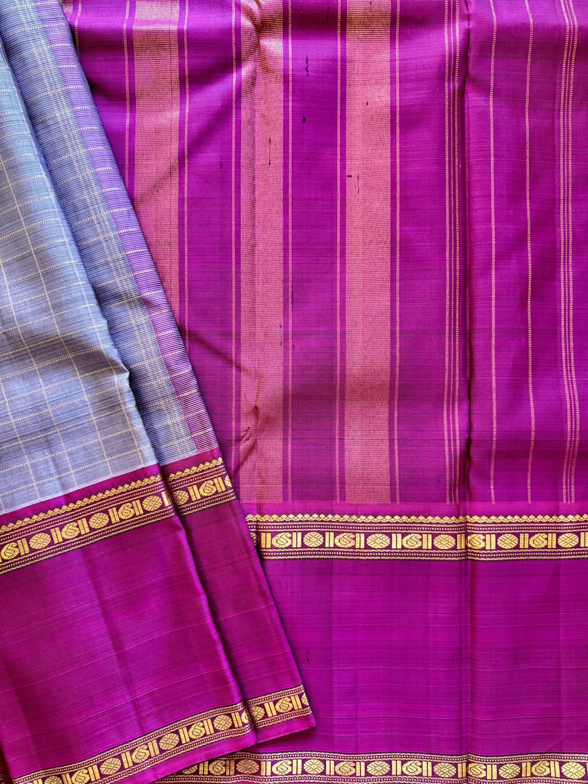 Aavani grey shot Ganga Yamuna Kanjivaram silk saree with contrast magenta and green borders.