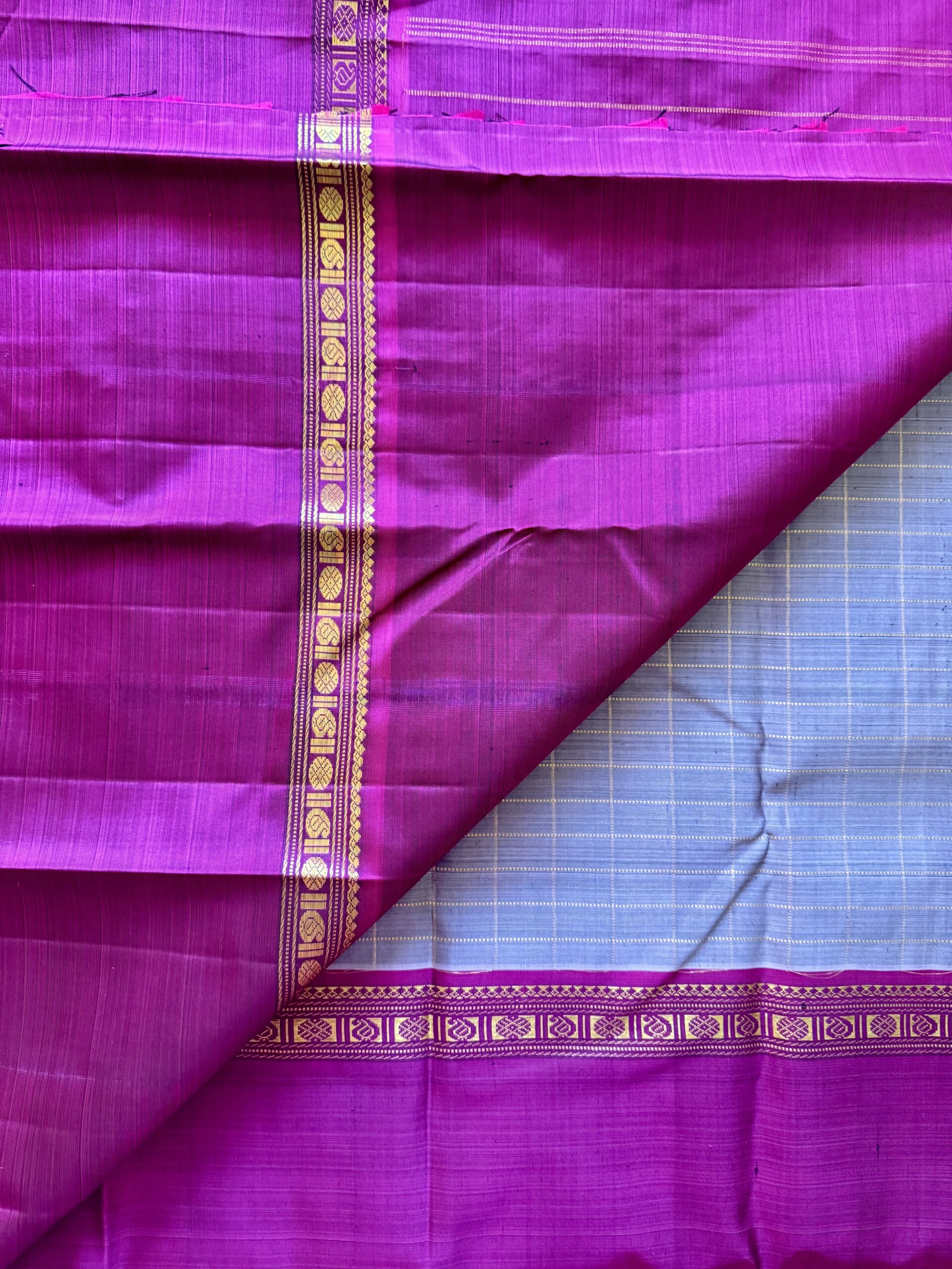 Aavani grey shot Ganga Yamuna Kanjivaram silk saree with contrast magenta and green borders.