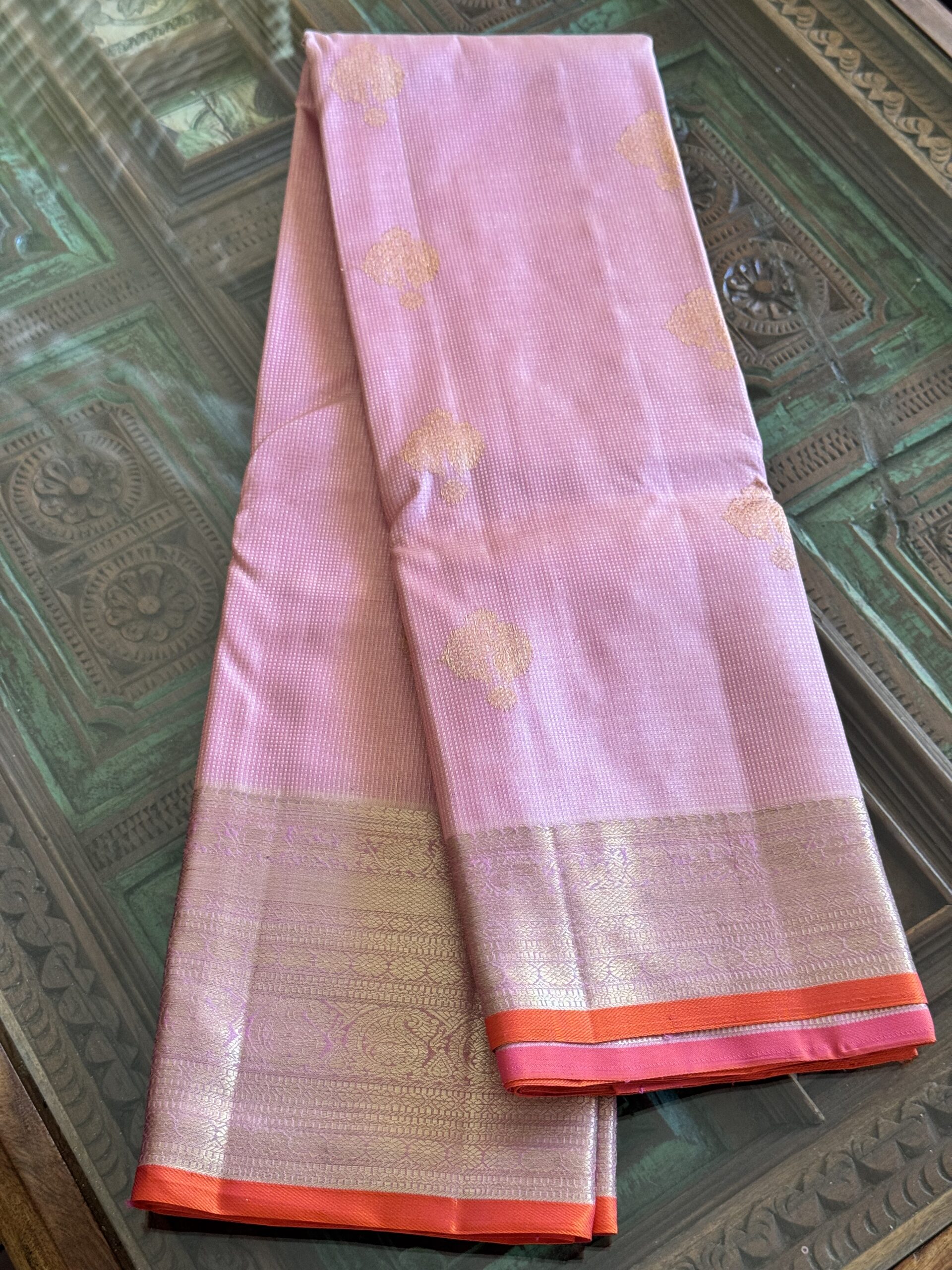 Amara pink and onion shot Kanjivaram silk saree with zari checks and mango and annam motif borders.