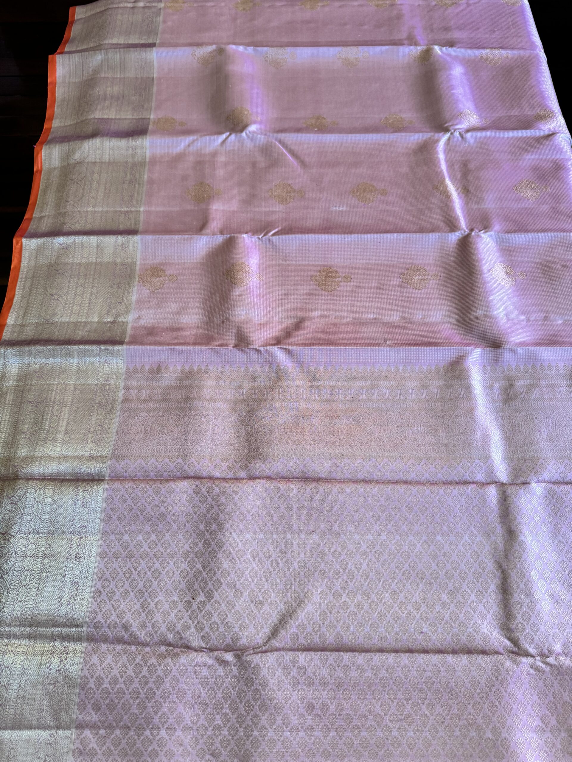 Amara pink and onion shot Kanjivaram silk saree with zari checks and mango and annam motif borders.