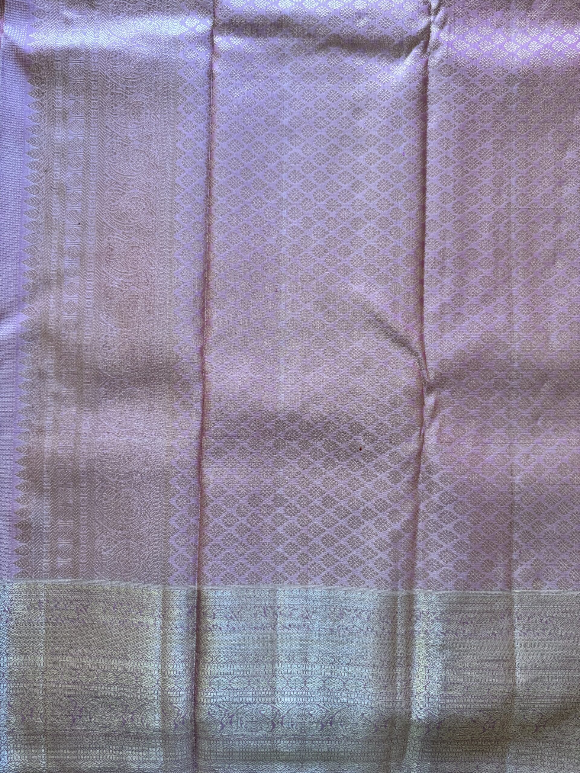 Amara pink and onion shot Kanjivaram silk saree with zari checks and mango and annam motif borders.
