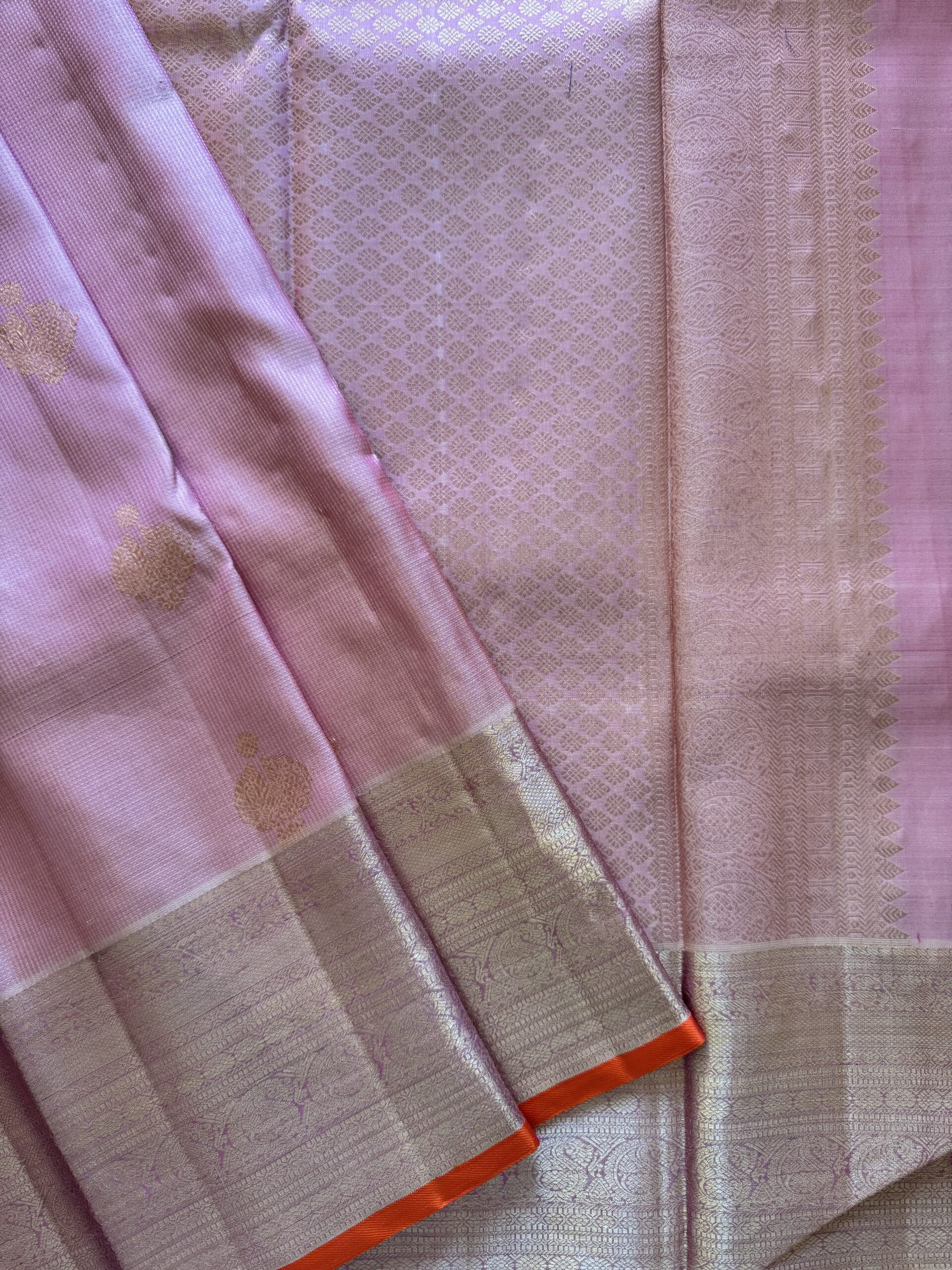Amara pink and onion shot Kanjivaram silk saree with zari checks and mango and annam motif borders.