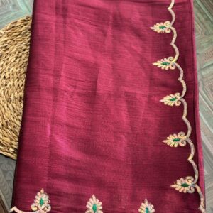 Manjari wine handwoven tissue silk saree folded, showing full scalloped hand-embroidered border with gold sequin and emerald green thread motifs — Tari by Gayatri