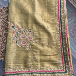 Suvarna antique gold handwoven tissue silk saree folded, showing full three-layered border in zari, forest green and fuchsia pink — Tari by Gayatri