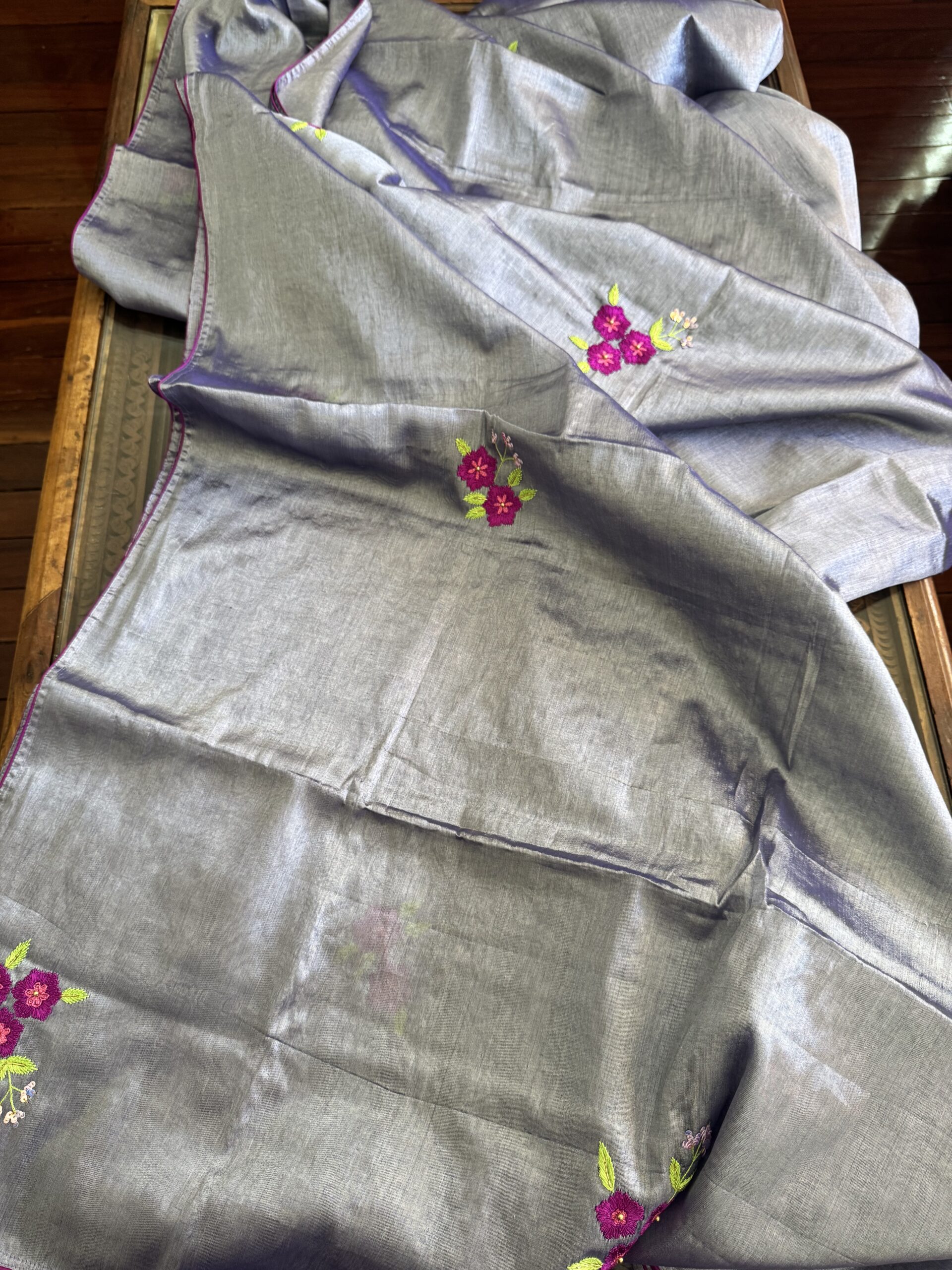 Single hand-embroidered magenta floral sprig with lime green leaves on Shubhra silver-grey tissue silk saree — Tari by Gayatri