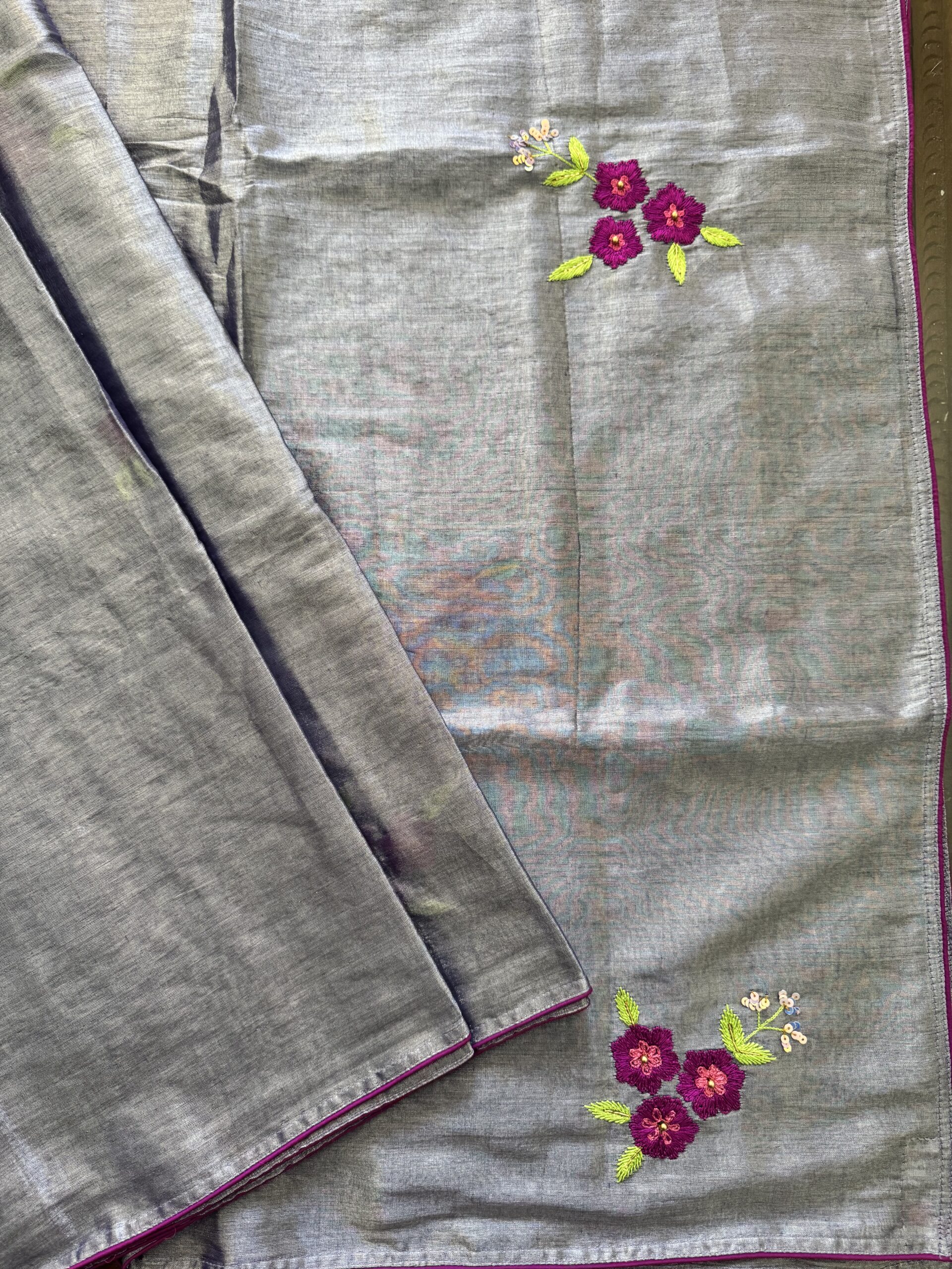 Single hand-embroidered magenta floral sprig with lime green leaves on Shubhra silver-grey tissue silk saree — Tari by Gayatri
