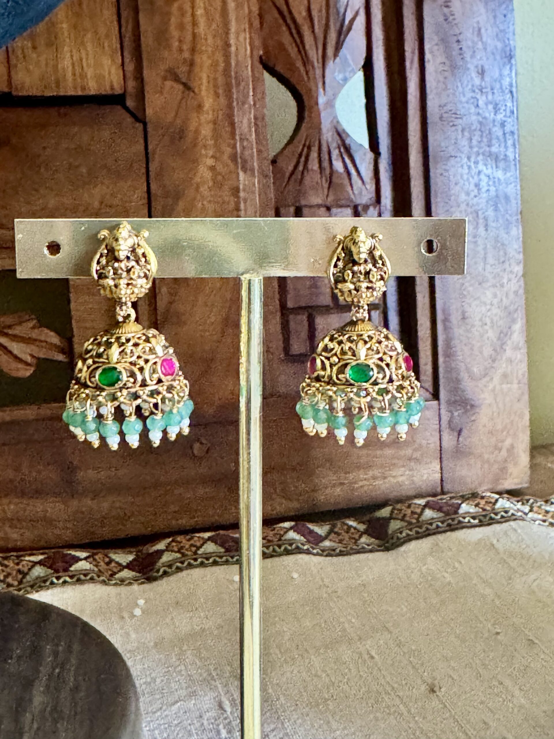 ROOR traditional temple jewellery set featuring an antique gold necklace and matching jhumki earrings with light green beads