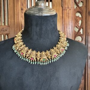 ROOR traditional temple jewellery set featuring an antique gold necklace and matching jhumki earrings with light green beads