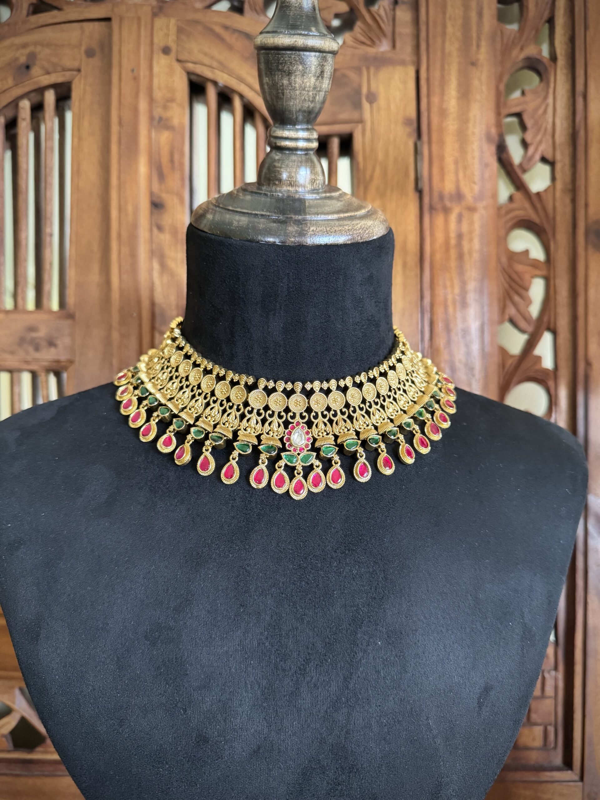BROE antique gold choker necklace with a coin pattern and pink and green teardrop stones