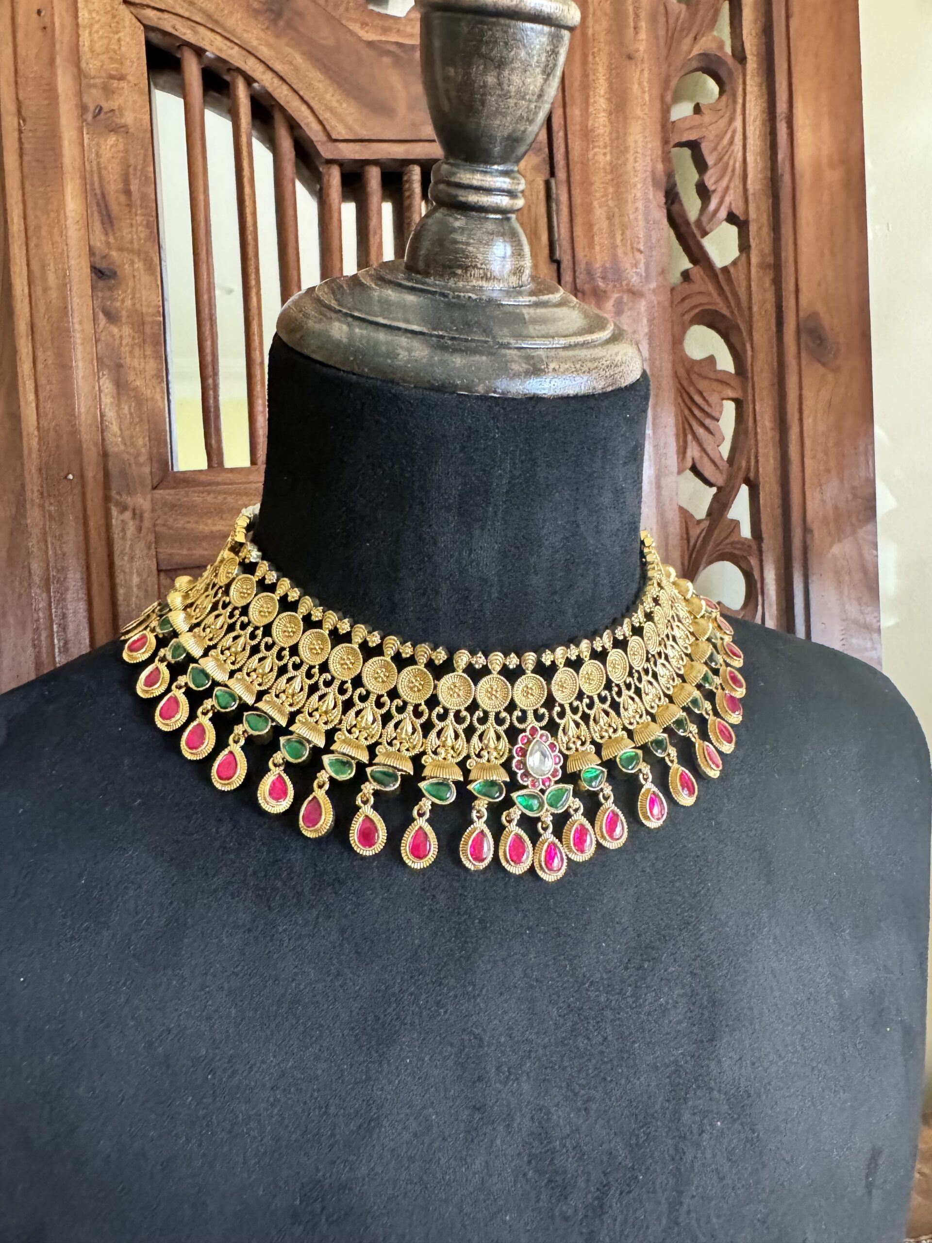 BROE antique gold choker necklace with a coin pattern and pink and green teardrop stones