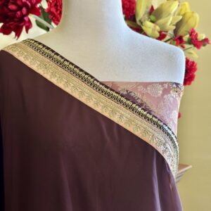 Kriti chocolate brown georgette saree with an embroidered border and a Banarasi blouse piece.