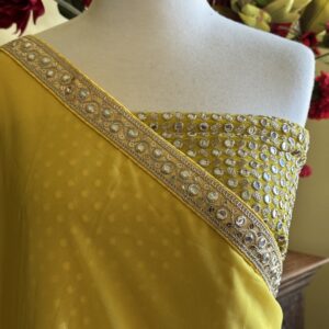 Avani bright yellow georgette saree with a mirror embroidery border and a heavy mirror work blouse piece.