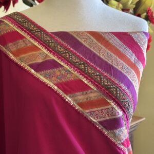 Dia rani pink georgette saree with a multicolour striped border and gold embroidery